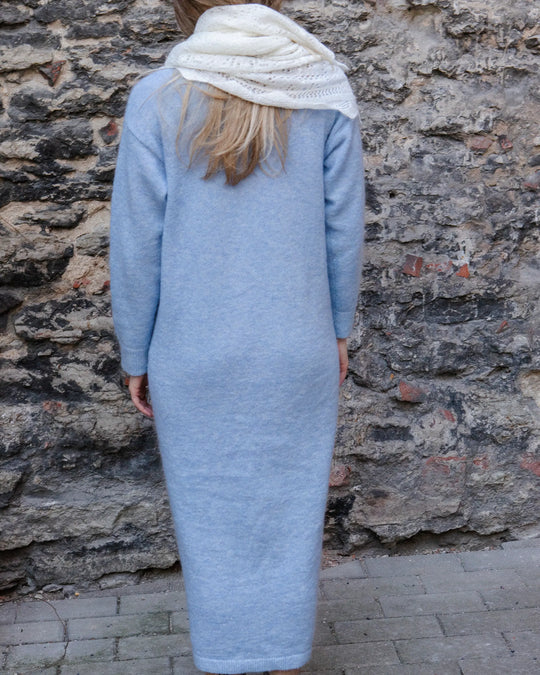 Full-length back view of a woman wearing the Adele & Soleil Lundi Matin sky blue longline cardigan.