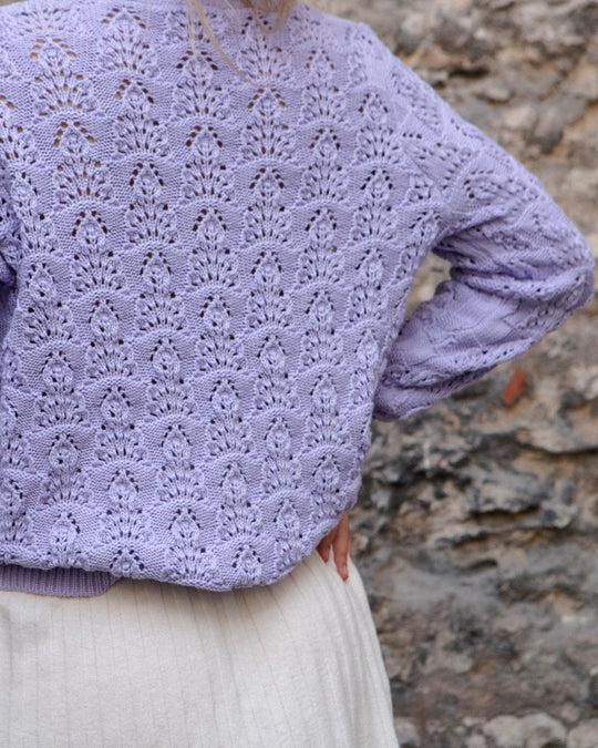 Close-up of the textured pointelle knit on the back of the Adele & Soleil Sérène lavender cotton cardigan.
